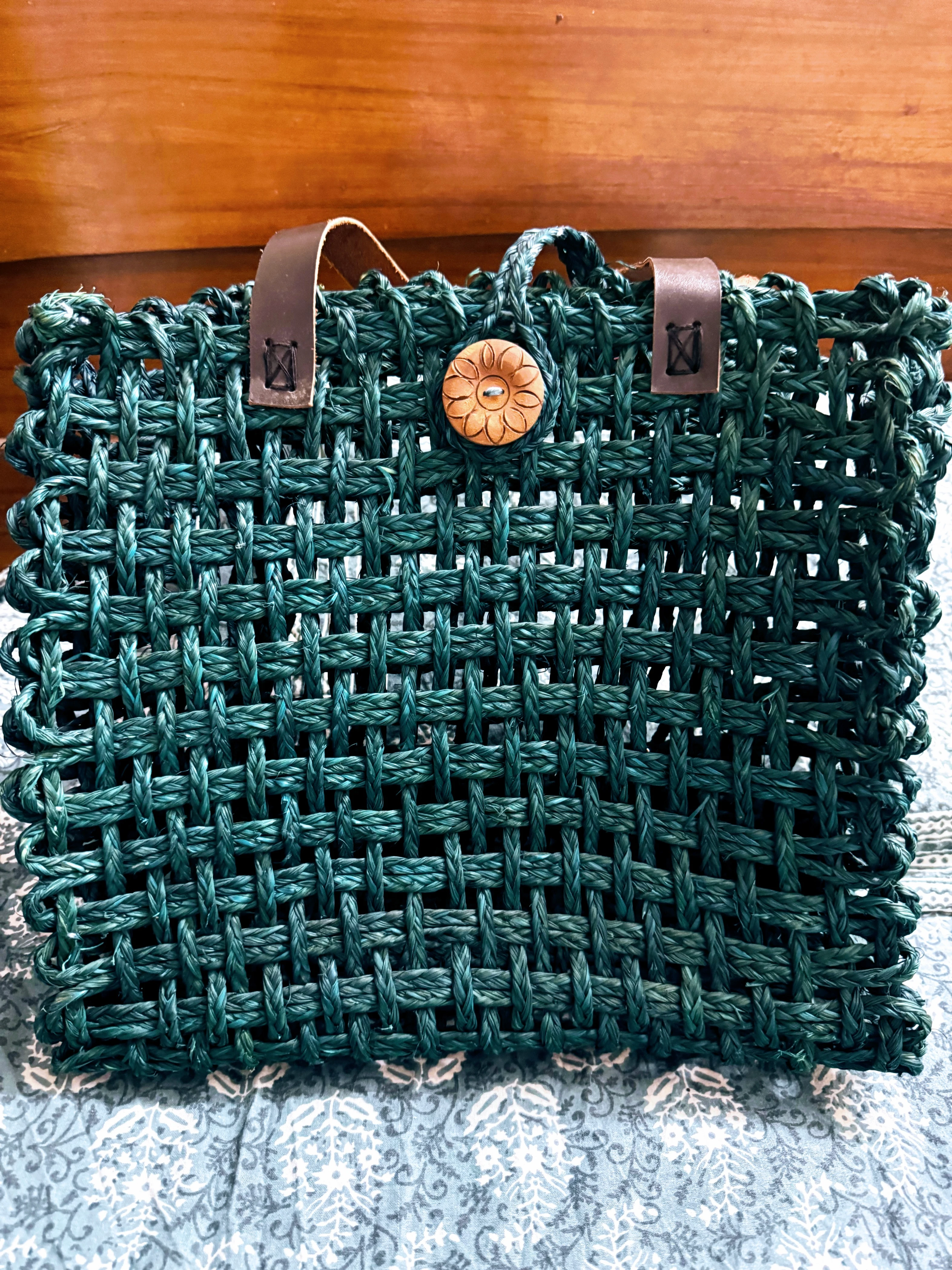 Coiled sabai grass handbag